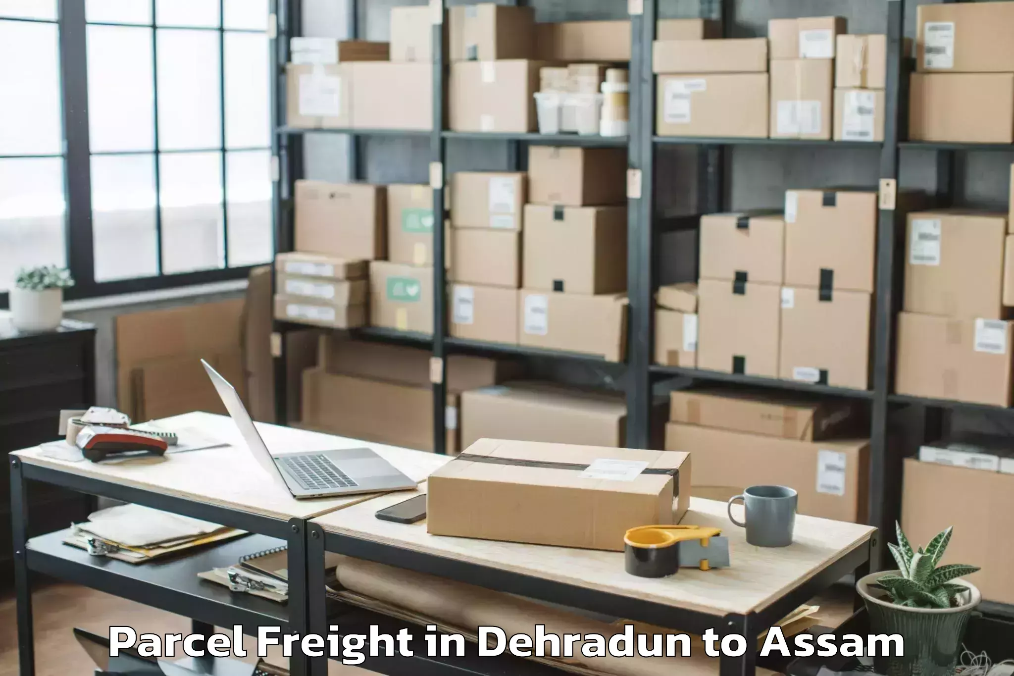 Affordable Dehradun to Numaligarh Parcel Freight